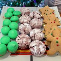 Variety of Christmas cookies; macarons, red velvet crinkle cookies and gingerbread